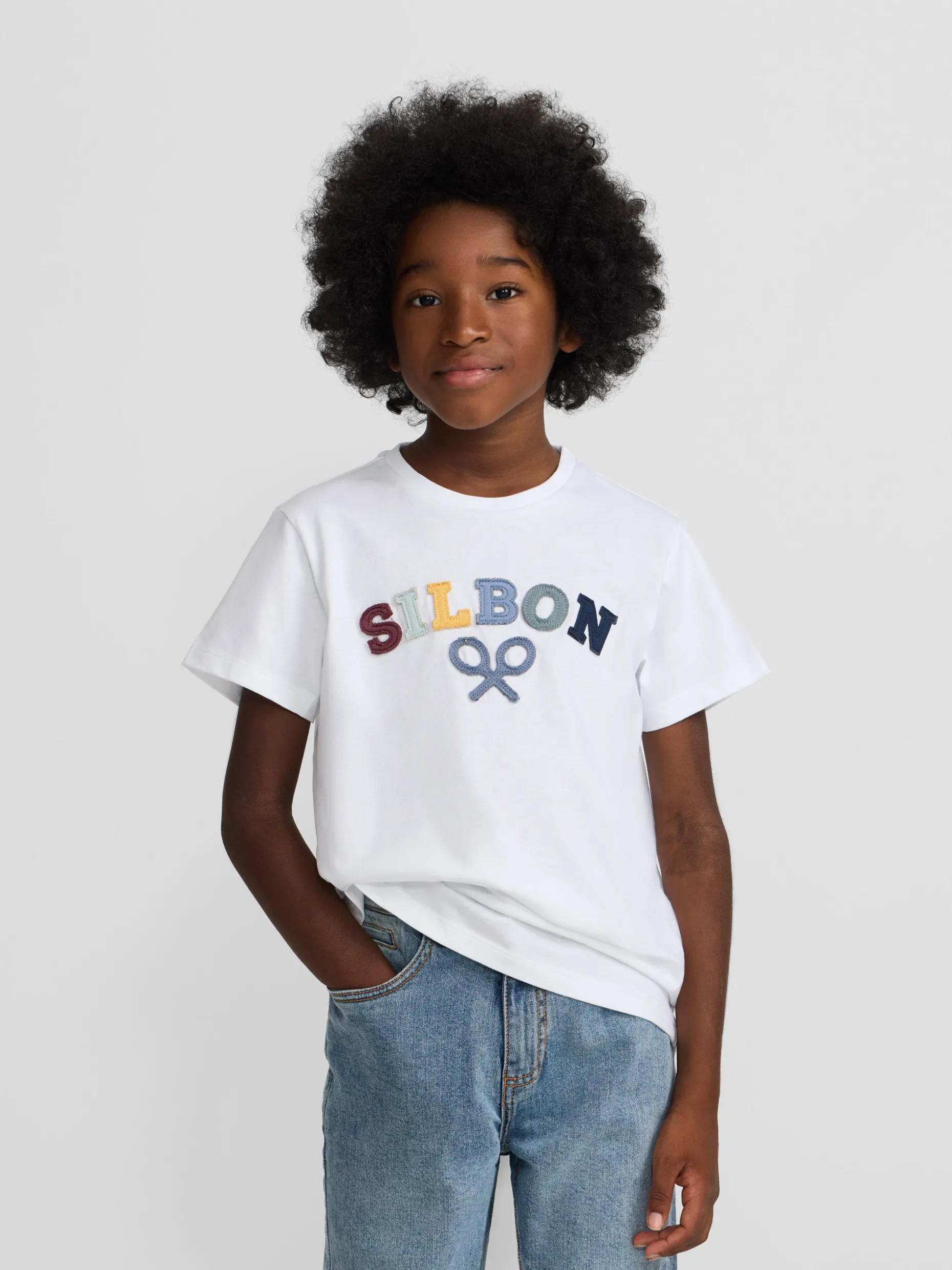 Camiseta kids raqueta media multicolor blanca