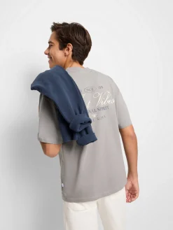 Camiseta relaxed just vibes gris