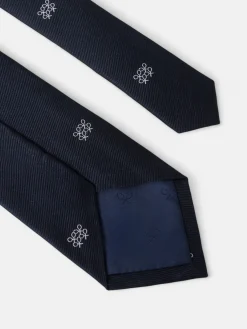 Corbata motivo geometrico raquetas azul marino