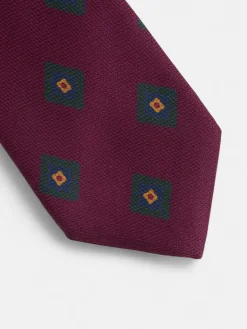 Corbata seda motivo geometrico burdeos