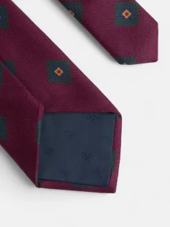 Corbata seda motivo geometrico burdeos