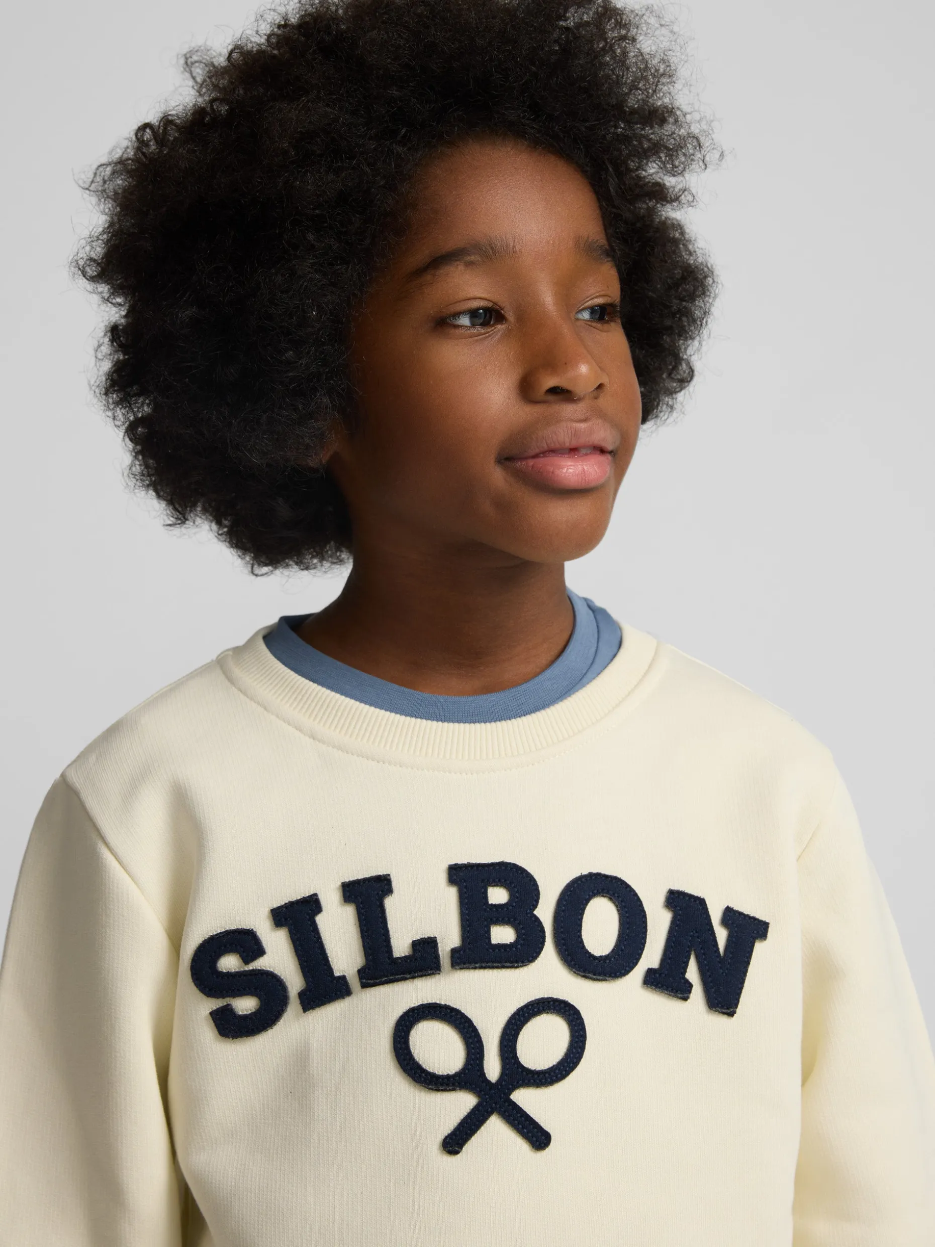 Sudadera kids raqueta media crema