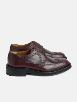 Zapato clasico piel perforado burdeos